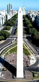 Aerial view of a city obelisk surrounded by streets and buildings.