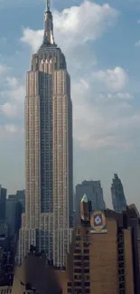 Empire State Building under a sunny sky.