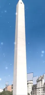 Iconic obelisk against a vibrant blue sky in a lively cityscape.