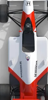 Top view of an iconic red and white racing car with a sleek design.