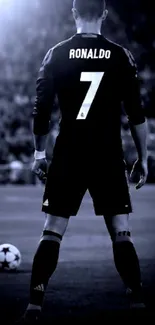 Breathtaking black and white soccer player wallpaper in a stadium setting.