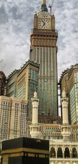 Majestic view of Mecca's iconic clock tower under a cloudy sky.