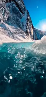 Stunning icy mountain lake with bright blue waves under a clear sky.