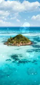 Aerial view of a tiny island surrounded by vibrant turquoise ocean.