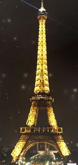 Illuminated Eiffel Tower wallpaper at night showcasing its golden glow.