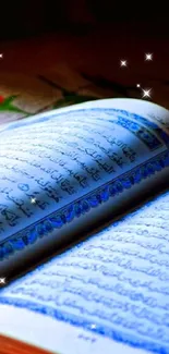 Beautiful illuminated Quran with blue details on colorful fabric background.