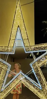 Glowing star-shaped decoration in a night scene with palm trees.