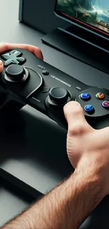 Hands gripping a game controller in front of a gaming screen.