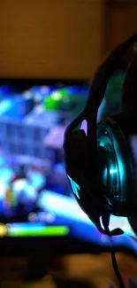 Close-up of a gamer wearing a headset, absorbed in colorful onscreen action.