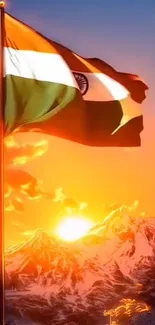 Indian flag waving at sunset over mountains.