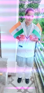 Person holding Indian flags on a balcony.