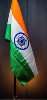 Illuminated Indian flag on a dark background.