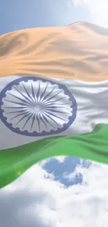 Indian flag waves against the bright blue sky.
