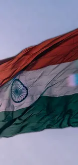 Indian flag waving in the sky, showcasing vibrant tricolors.
