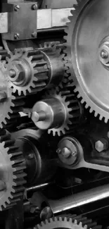 Black and white industrial gears in motion in a mechanical design.