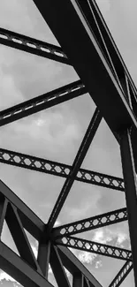 Industrial steel frame against a cloudy sky, capturing architectural beauty.