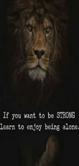 Lion with inspiring quote on strength and solitude, dark background.