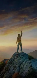 Person celebrating on a mountain peak at sunset.