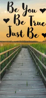 Serene boardwalk through green meadow at sunset with quote: Be You, Be True, Just Be.