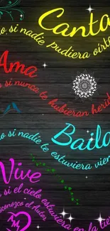 Colorful neon Spanish quotes on dark wood background.