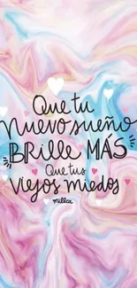 Pastel swirl wallpaper with motivational quote in Spanish.