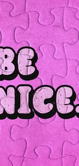 Vibrant pink puzzle wallpaper with 'Be Nice' text.