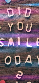 Inspirational quote 'Did You Smile Today?' on rustic wood with colorful dots.