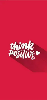 Think Positive red wallpaper with heart and shadow.