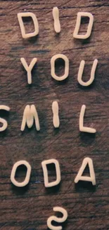 Inspirational wallpaper with 'Did You Smile Today?' on wooden background.