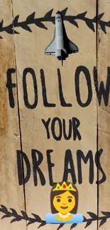 Wooden sign with 'Follow Your Dreams' on a beige background.