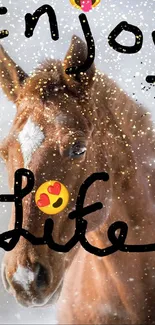 Brown horse in snow with 'Enjoy Life' text.