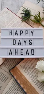 Lightbox with 'Happy Days Ahead' on books.