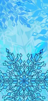 Intricate blue snowflake design wallpaper.