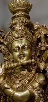 Intricate brass deity sculpture with detailed design and rich cultural artistry.