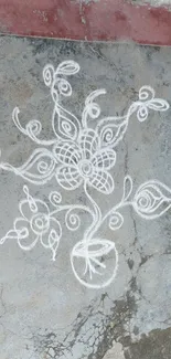 Intricate chalk art on a stone background.