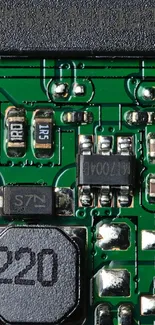 Close-up image of a green circuit board with intricate electronic components.