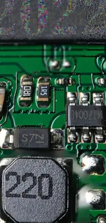 Close-up of a green electronic circuit board with detailed components.