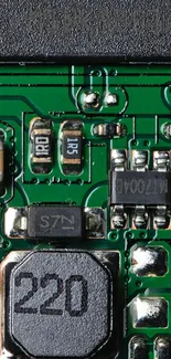 Close-up of a green circuit board with electronic components.