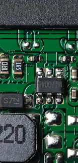 A detailed mobile phone wallpaper showing a green circuit board with electronic components.