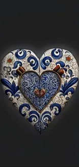 Intricate heart design with blue patterns on dark background.