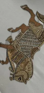 Intricate embroidery depicting a horse in beige and brown tones on light fabric.