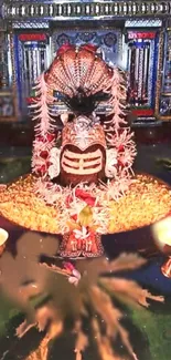 Colorful lingam altar with vibrant decor and sacred lighting in a Hindu temple.