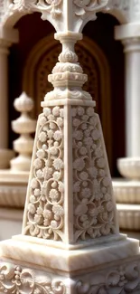 Cream-colored detailed marble sculpture with intricate carvings.