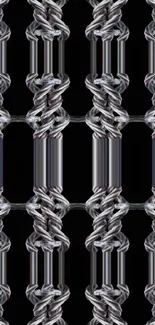 Intricate metal chain pattern wallpaper on a black background.