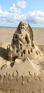 Intricate sand sculpture on beach with ocean in background.