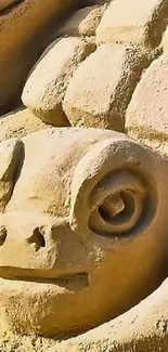 Detailed sand turtle sculpture on beach