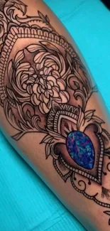 Intricate floral tattoo design with a jewel on light blue background.