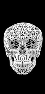 Intricate white skull on black background wallpaper.