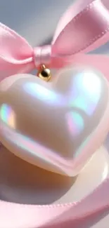 Iridescent heart ornament with pink ribbon.