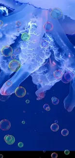 Jellyfish in blue water with rainbow bubbles.